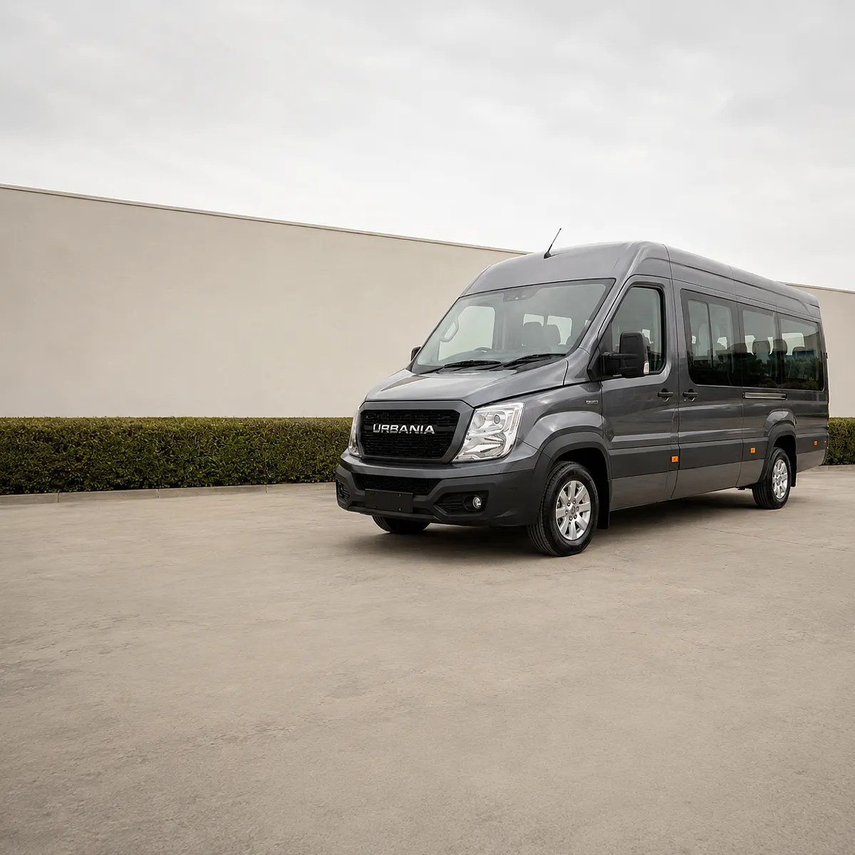 A washed Force Urbania parked and ready outside an office under a bright overcast sky